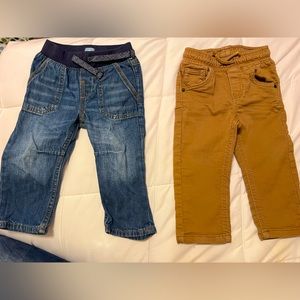 2 pairs of boys bottoms. I pair of jeans and 1 pair of skinny fit brown chinos.